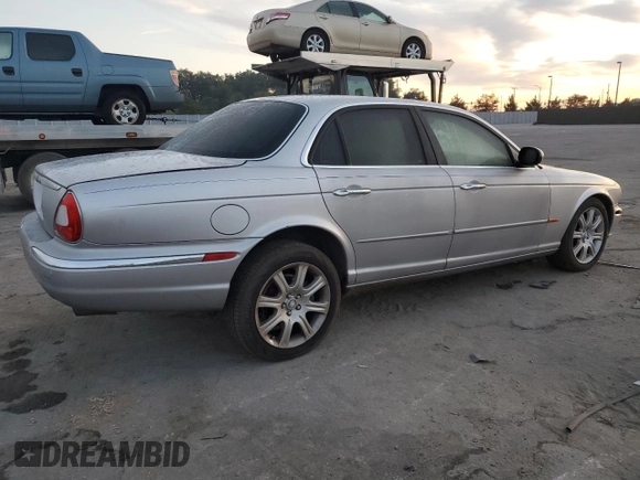 2004 Jaguar XJ with VIN SAJEA71C54SG01326, listed as a Copart auction lot 77449324 with 72,935 mi miles and Salvage Title. Bid and sale history available at carsss.com. Image 3.