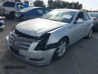 2009 Cadillac CTS RWD w/1SA with VIN 1G6DJ577690159748, listed as a IAAI auction lot 41544651 with 100,931 mi miles. Bid and sale history available at carsss.com. Image 2.