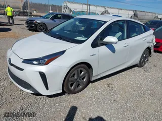 2021 Toyota Prius L Eco with VIN JTDKAMFUXM3142402, listed as a IAAI auction lot 41665484 with 67,416 mi miles. Bid and sale history available at carsss.com. Image 17.