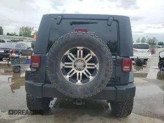 2007 Jeep Wrangler Unlimited Sahara with VIN 1J4GB59177L226122, listed as a Copart auction lot 55529575 with 208,811 mi miles and Salvage title. Bid and sale history available at DreamBid. Image 6.