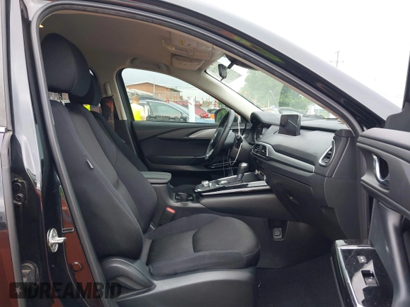2021 Mazda CX-9 Sport with VIN JM3TCABY6M0522352, listed as a IAAI auction lot 42613136 with 106,167 mi miles and . Bid and sale history available at DreamBid. Image 5.