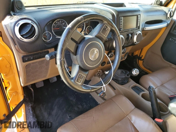 2012 Jeep Wrangler Rubicon with VIN 1C4BJWCG2CL135789, listed as a Copart auction lot 42556365 with 121,908 mi miles and Salvage title. Bid and sale history available at DreamBid. Image 8.