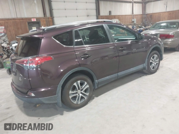 2018 Toyota RAV4 LE with VIN 2T3BFREV0JW759714, listed as a IAAI auction lot 41823084 with 119,909 mi miles and . Bid and sale history available at DreamBid. Image 4.