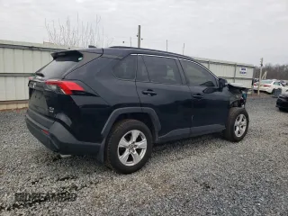 2019 Toyota RAV4 XLE with VIN JTMP1RFV9KD506960, listed as a Copart auction lot 50242025 with 102,157 mi miles and Salvage Title. Bid and sale history available at DreamBid. Image 3.