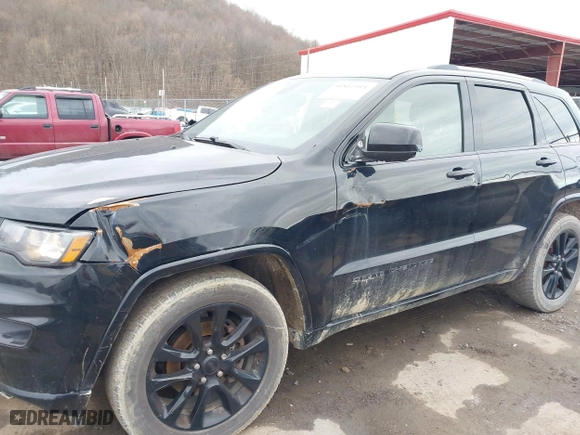 2018 Jeep Grand Cherokee Laredo E with VIN 1C4RJFAG3JC324434, listed as a IAAI auction lot 41812311 with 140,820 mi miles. Bid and sale history available at carsss.com. Image 6.