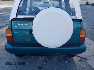 1995 Suzuki Sidekick z VIN 2S3TA02C3S6414337, wystawiony jako Copart lot #86304134 z przebiegiem 104 889 mil mil oraz Szkody całkowita. Historia ofert i sprzedaży dostępna na DreamBid. Obrazek 10.