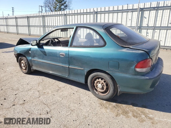 1999 Hyundai Accent z VIN KMHVD14N4XU456698, wystawiony jako Copart lot #41733345 z przebiegiem 197 574 mil mil oraz Szkody całkowita. Historia ofert i sprzedaży dostępna na DreamBid. Obrazek 2.