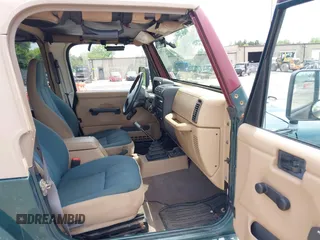 1999 Jeep Wrangler Sahara z VIN 1J4FY49S7XP442719, wystawiony jako IAAI lot #42506510 z przebiegiem 188 175 mil mil oraz . Historia ofert i sprzedaży dostępna na DreamBid. Obrazek 5.