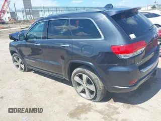 2015 Jeep Grand Cherokee High Altitude with VIN 1C4RJFCG5FC807394, listed as a IAAI auction lot 42452034 with 72,011 mi miles and . Bid and sale history available at DreamBid. Image 3.