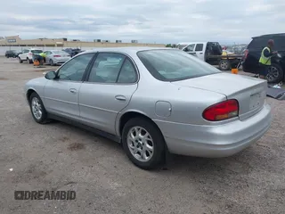 2002 Oldsmobile Intrigue GX z VIN 1G3WH52H22F149397, wystawiony jako IAAI lot #42265108 z przebiegiem 107 834 mil mil oraz . Historia ofert i sprzedaży dostępna na DreamBid. Obrazek 3.