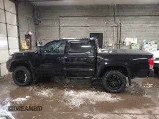 2016 Toyota Tacoma SR with VIN 3TMCZ5AN5GM037336, listed as a IAAI auction lot 41599492 with 76,262 mi miles. Bid and sale history available at carsss.com. Image 14.