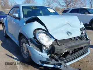 2014 Volkswagen Beetle 2.5L w/Sun with VIN 3VWJP7AT6EM601318, listed as a IAAI auction lot 41902598 with 169,220 mi miles and . Bid and sale history available at DreamBid. Image 1.