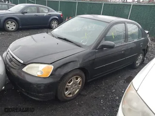 2001 Honda Civic LX with VIN 2HGES16511H554283, listed as a IAAI auction lot 41820187 with 999,999 mi miles. Bid and sale history available at carsss.com. Image 2.