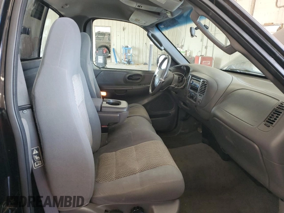 2003 Ford F-150 with VIN 2FTRF08L03CA03160, listed as a Copart auction lot 51591535 with 220,630 mi miles and Salvage title. Bid and sale history available at DreamBid. Image 10.