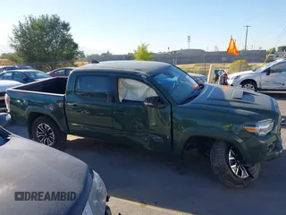 2021 Toyota Tacoma SR with VIN 3TYCZ5AN2MT039450, listed as a IAAI auction lot 40457613 with 54,176 mi miles and . Bid and sale history available at DreamBid. Image 13.