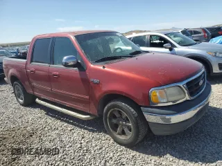 2001 Ford F-150 XLT with VIN 1FTRW07W71KE22482, listed as a Copart auction lot 62546815 with 218,501 mi miles and Clean title. Bid and sale history available at DreamBid. Image 4.