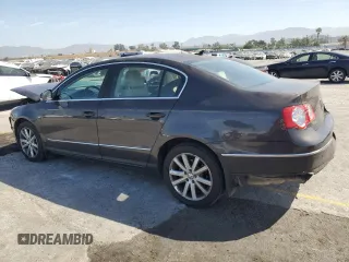 2010 Volkswagen Passat Komfort with VIN WVWJK7ANXAE129739, listed as a Copart auction lot 57798275 with 155,830 mi miles and Salvage title. Bid and sale history available at DreamBid. Image 2.