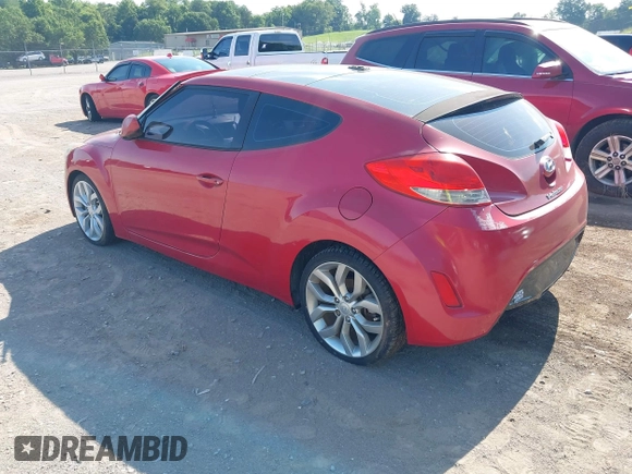 2012 Hyundai Veloster w/Black Int with VIN KMHTC6AD3CU032989, listed as a IAAI auction lot 42633748 with 137,727 mi miles and . Bid and sale history available at DreamBid. Image 3.