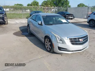 2015 Cadillac ATS Luxury RWD z VIN 1G6AB5RA6F0127029, wystawiony jako IAAI lot #42376359 z przebiegiem 131 823 mil mil oraz . Historia ofert i sprzedaży dostępna na DreamBid. Obrazek 1.