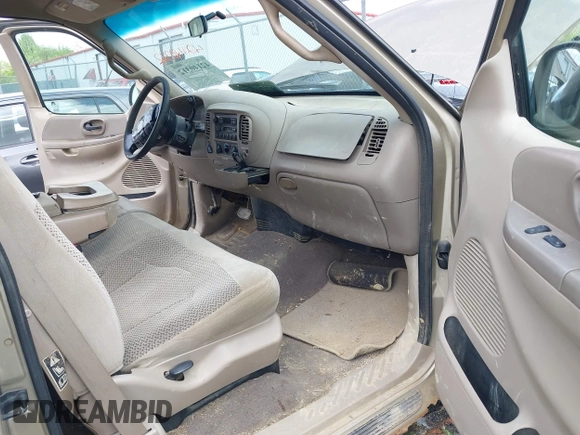 2000 Ford F-150 XL with VIN 1FTRX18L9YNB70363, listed as a IAAI auction lot 42140312 with 226,686 mi miles and . Bid and sale history available at DreamBid. Image 5.