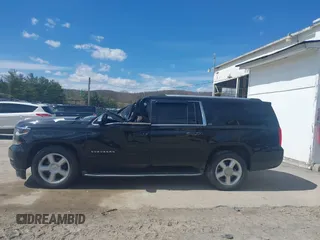 2015 Chevrolet Suburban LTZ with VIN 1GNSKKKC9FR280390, listed as a IAAI auction lot 41882449 with 80,499 mi miles and . Bid and sale history available at DreamBid. Image 14.