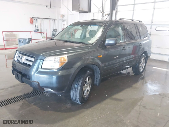 2006 Honda Pilot EX-L with RES with VIN 5FNYF28666B015764, listed as a IAAI auction lot 41703704 with 211,289 mi miles. Bid and sale history available at carsss.com. Image 2.