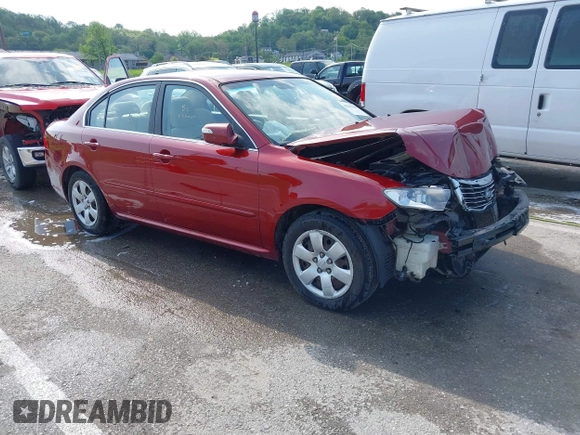 2010 Kia Optima LX z VIN KNAGG4A88A5435095, wystawiony jako IAAI lot #42085605 z przebiegiem 188 685 mil mil oraz . Historia ofert i sprzedaży dostępna na DreamBid. Obrazek 1.