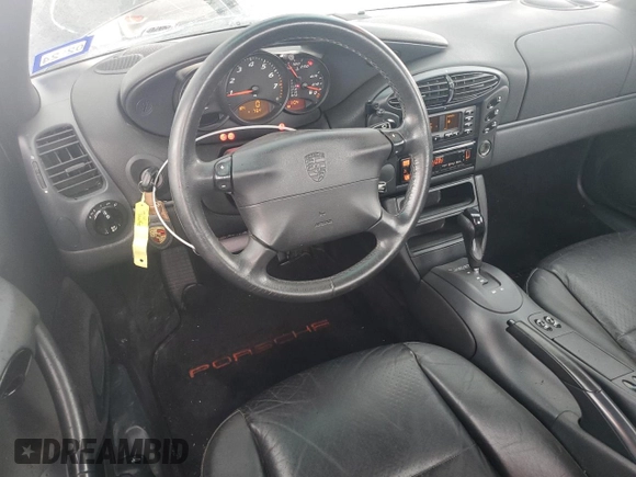 1998 Porsche Boxster с VIN WP0CA2982WU620882, выставлен на аукционе Copart как лот 50950515 с пробегом Не указан миль и Списание • Salvage title. История ставок и продаж доступна на DreamBid. Изображение 8.