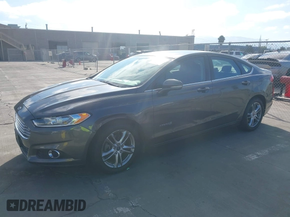 2016 Ford Fusion SE Hybrid z VIN 3FA6P0LU6GR145421, wystawiony jako IAAI lot #42650918 z przebiegiem 105 990 mil mil oraz . Historia ofert i sprzedaży dostępna na DreamBid. Obrazek 2.