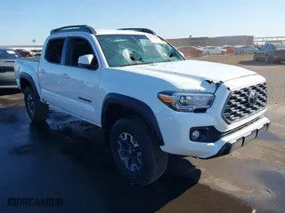2023 Toyota Tacoma 4WD SR with VIN 3TMCZ5AN6PM556699, listed as a IAAI auction lot 37700155 with 9,732 mi miles. Bid and sale history available at carsss.com. Image 1.