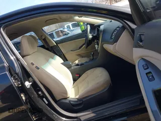 2015 Kia Optima LX with VIN KNAGM4A71F5652818, listed as a IAAI auction lot 41656933 with 251,967 mi miles. Bid and sale history available at carsss.com. Image 5.
