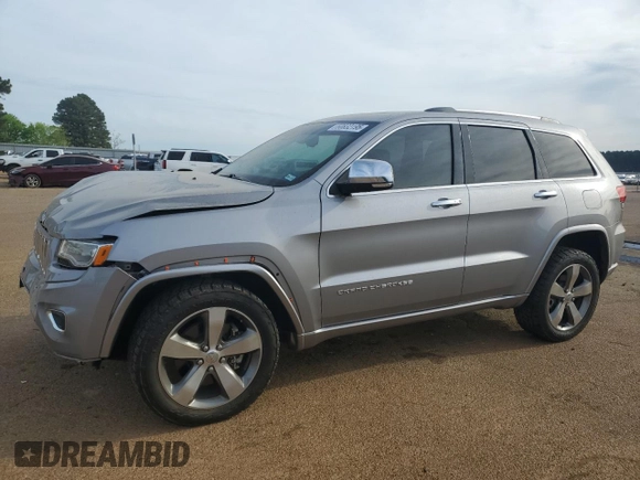 2016 Jeep Grand Cherokee Overland with VIN 1C4RJFCT2GC320247, listed as a Copart auction lot 50832195 with 104,300 mi miles and Salvage title. Bid and sale history available at DreamBid. Image 1.