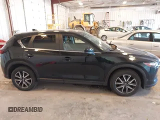 2018 Mazda CX-5 Touring with VIN JM3KFBCM9J0437490, listed as a IAAI auction lot 42006998 with 176,959 mi miles. Bid and sale history available at carsss.com. Image 13.