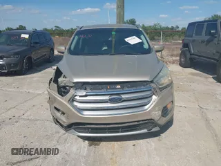 2017 Ford Escape SE z VIN 1FMCU0GD8HUC60074, wystawiony jako IAAI lot #41918443 z przebiegiem 85 787 mil mil oraz . Historia ofert i sprzedaży dostępna na DreamBid. Obrazek 13.