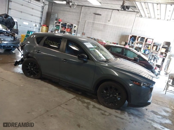 2023 Mazda CX-5 2.5 S Carbon Edition with VIN JM3KFBCM8P0211434, listed as a IAAI auction lot 41804865 with 24,289 mi miles. Bid and sale history available at carsss.com. Image 1.