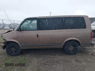 1997 Chevrolet Astro z VIN 1GNDM19W7VB232813, wystawiony jako IAAI lot #42046310 z przebiegiem Nie podano mil oraz . Historia ofert i sprzedaży dostępna na DreamBid. Obrazek 14.