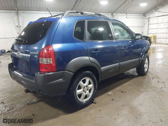2005 Hyundai Tucson GLS with VIN KM8JN72D55U182689, listed as a IAAI auction lot 41512644 with 238,707 mi miles. Bid and sale history available at carsss.com. Image 4.