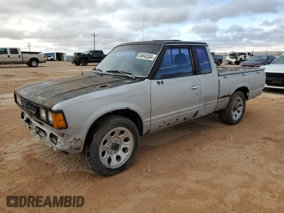 1982 Datsun 720 z VIN JN6MD06S6CW100827, wystawiony jako Copart lot #80042334 z przebiegiem 141 251 mil mil oraz Tytuł czysty. Historia ofert i sprzedaży dostępna na DreamBid. Obrazek 1.