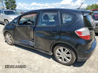 2011 Honda Fit Sport with VIN JHMGE8H57BC024827, listed as a Copart auction lot 59704194 with 146,316 mi miles and Salvage Title. Bid and sale history available at DreamBid. Image 2.
