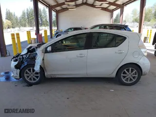 2012 Toyota Prius c One with VIN JTDKDTB35C1015176, listed as a IAAI auction lot 42053659 with 94,565 mi miles. Bid and sale history available at carsss.com. Image 14.