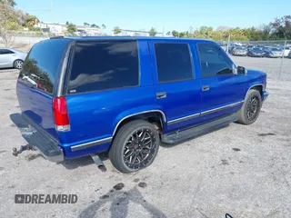 1997 GMC Yukon with VIN 1GKEC13R0VJ744958, listed as a IAAI auction lot 41474196 with 257,847 mi miles. Bid and sale history available at carsss.com. Image 4.