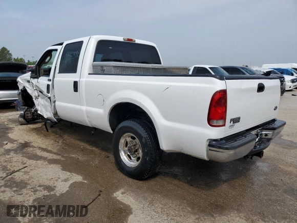 2004 Ford Super Duty F-250 XL with VIN 1FTNW21P14EA23582, listed as a Copart auction lot 62658954 with 205,382 mi miles and Salvage Title. Bid and sale history available at carsss.com. Image 2.