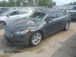 2018 Ford Fusion SE z VIN 3FA6P0H78JR261102, wystawiony jako Copart lot #69963883 z przebiegiem 120 068 mil mil oraz Czysty tytuł • Clean title. Historia ofert i sprzedaży dostępna na DreamBid. Obrazek 1.