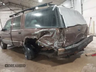 1994 GMC Suburban with VIN 1GKEC16K1RJ738915, listed as a IAAI auction lot 41717424 with 173,338 mi miles. Bid and sale history available at carsss.com. Image 3.