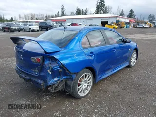 2015 Mitsubishi Lancer Evolution GSR with VIN JA32W8FV4FU012578, listed as a IAAI auction lot 41730742 with 64,762 mi miles. Bid and sale history available at carsss.com. Image 4.