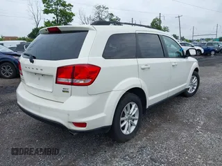 2017 Dodge Journey SXT with VIN 3C4PDDBG2HT702775, listed as a IAAI auction lot 42596303 with 130,639 mi miles and . Bid and sale history available at DreamBid. Image 4.