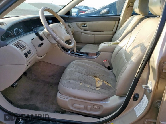 2000 Toyota Avalon XL z VIN 4T1BF28B7YU074685, wystawiony jako Copart lot #54523145 z przebiegiem 172 258 mil mil oraz Szkoda całkowita • Salvage title. Historia ofert i sprzedaży dostępna na DreamBid. Obrazek 7.