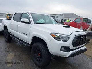 2022 Toyota Tacoma SR with VIN 3TMCZ5ANXNM467411, listed as a IAAI auction lot 41790995 with 57,091 mi miles and . Bid and sale history available at DreamBid. Image 1.