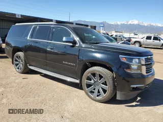 2015 Chevrolet Suburban LTZ with VIN 1GNSKKKC2FR634654, listed as a Copart auction lot 50337415 with 150,255 mi miles and Salvage Title. Bid and sale history available at DreamBid. Image 4.