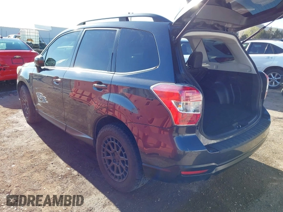 2015 Subaru Forester 2.0XT Premium with VIN JF2SJGDC2FH532994, listed as a IAAI auction lot 41797117 with 104,571 mi miles. Bid and sale history available at carsss.com. Image 3.